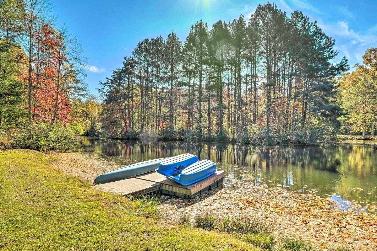 View of the pond with paddle boat and canoe