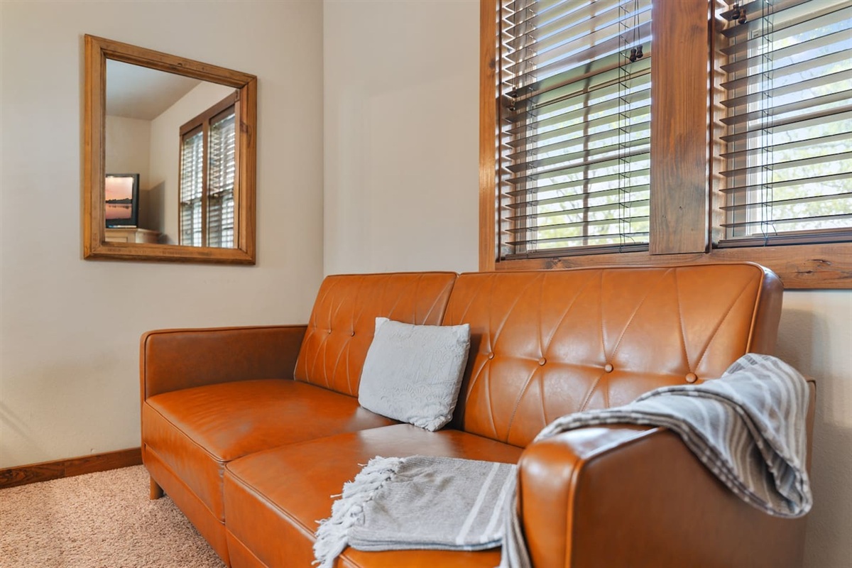 A cozy sitting area that makes in to a bed gives you another quiet spot to relax with a book or morning coffee.