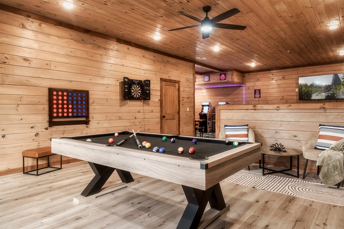 Game Room with pool table, arcades, other games and TV, Theater in background