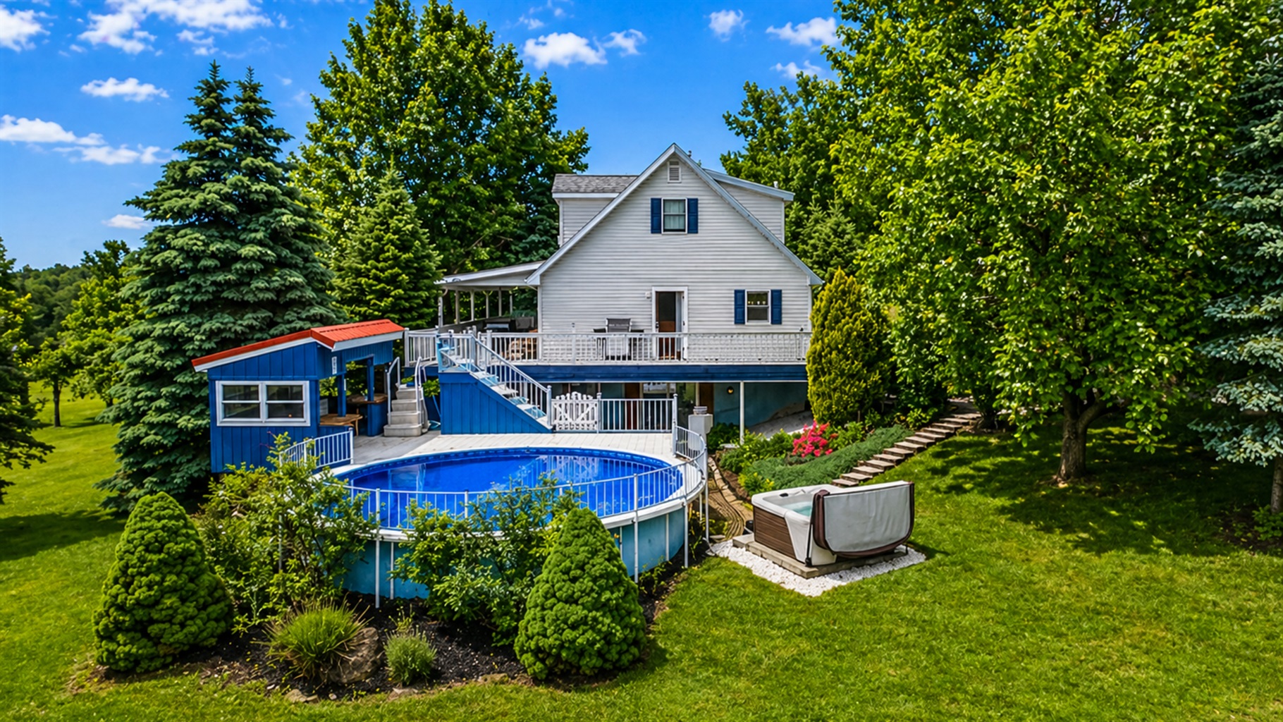 Enjoy a refreshing dip in the private pool surrounded by lush greenery and a cozy outdoor area.