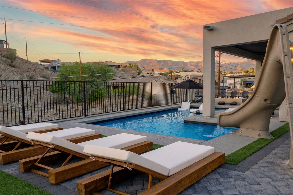Four lounge chairs for sunbathing.