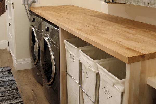 The laundry area provides three separate canvas bags for each guest