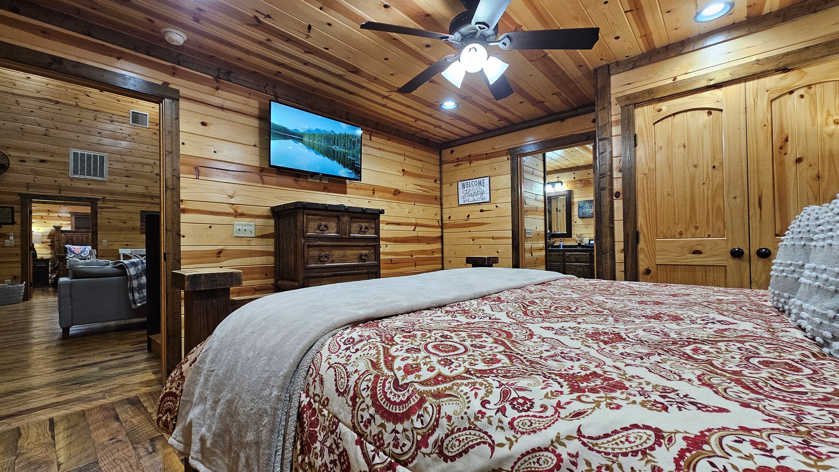 Bedroom 2: Rustic charm with wooden accents and plush bedding for a perfect getaway!