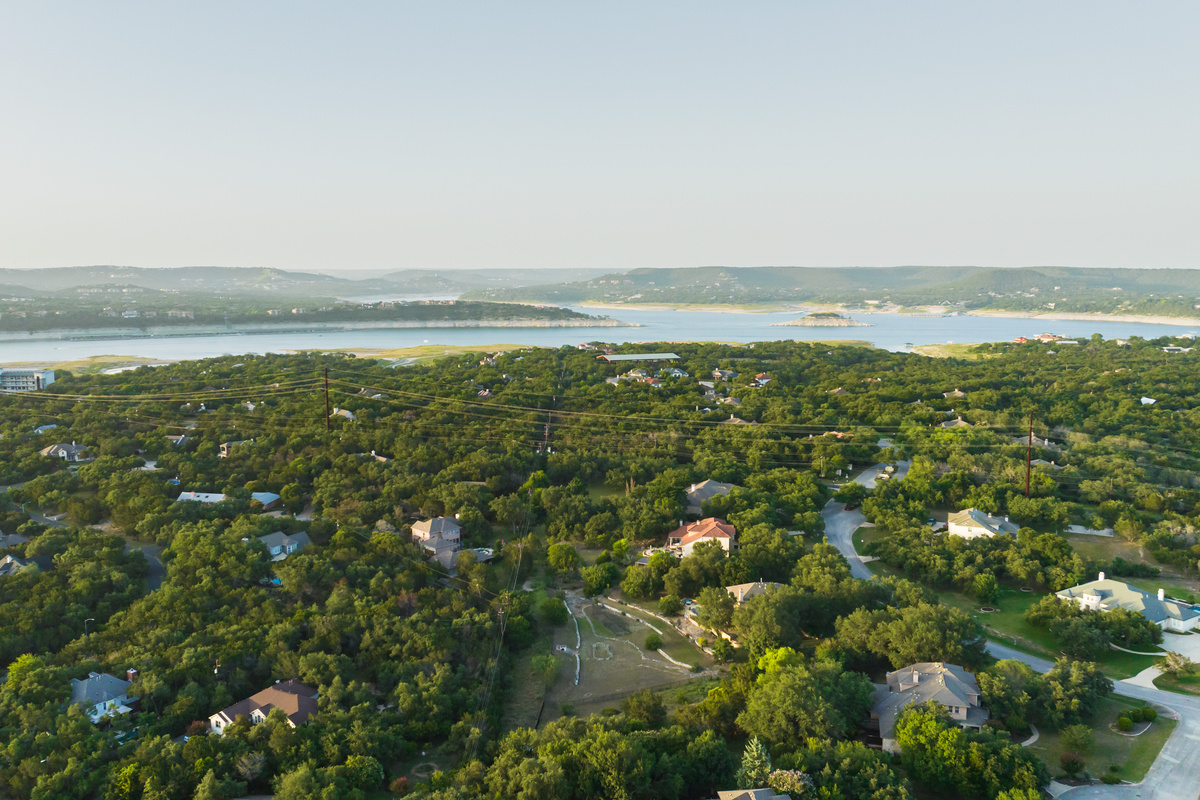 Enjoy the best of the Lake Travis lifestyle from this peaceful Rocky Ridge setting. The home is located near Lake Travis and Paradise Cove Marina, offering a convenient base for boating, lake days, outdoor adventures, dining, and exploring the surrounding 