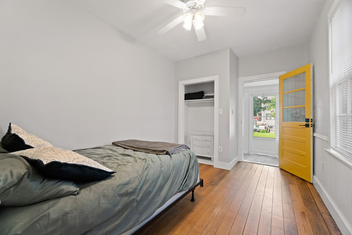 Private bedroom with its own door leading directly outside, offering easy access to the outdoors for a seamless indoor-outdoor living experience.