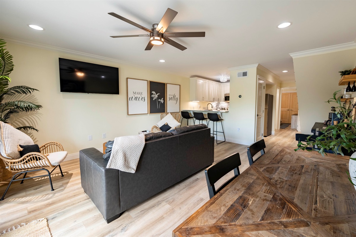 Modern comfort: open living room and kitchen with cozy vibes and natural light.