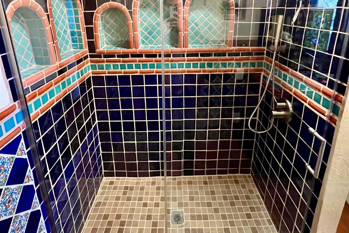 Relax and rejuvenate in a beautifully remodeled walk-in shower.