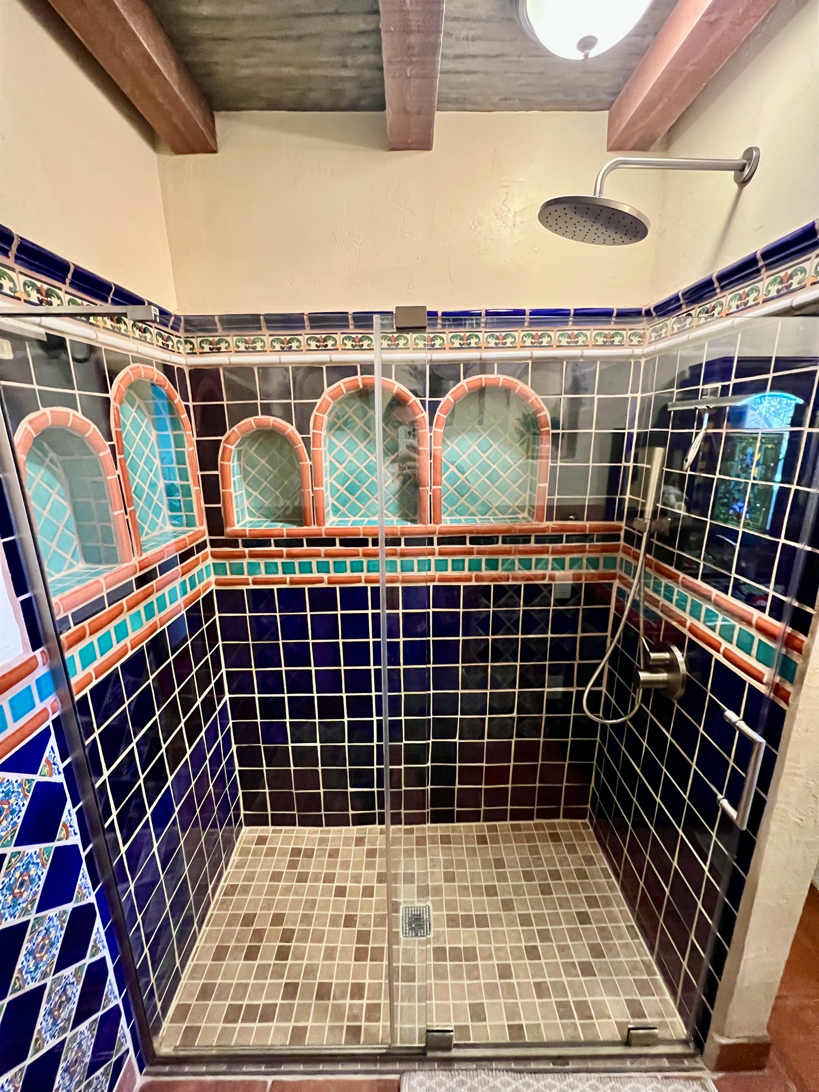 Relax and rejuvenate in a beautifully remodeled walk-in shower.