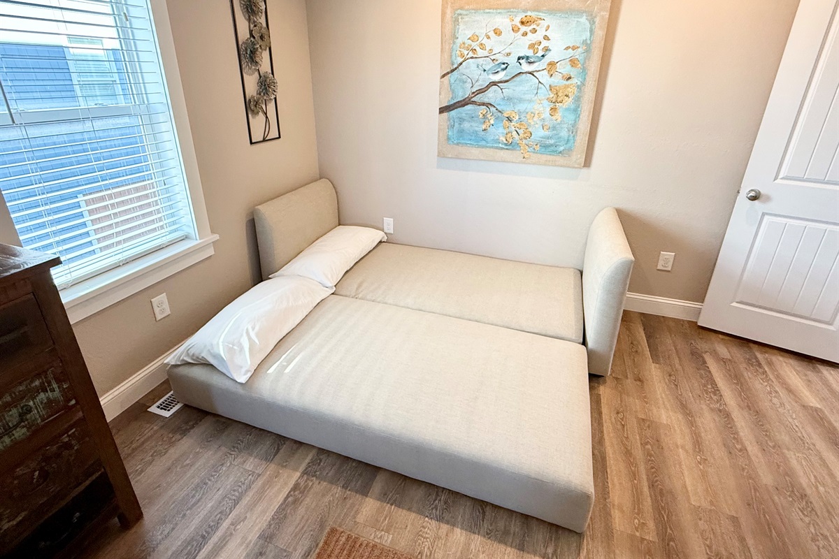 Daybed queen sleeper. Extra linens provided.