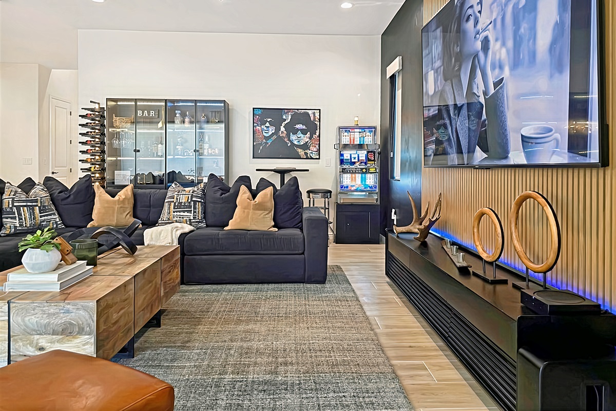 100" HDTV in living area with Sono's home theater surround sound.