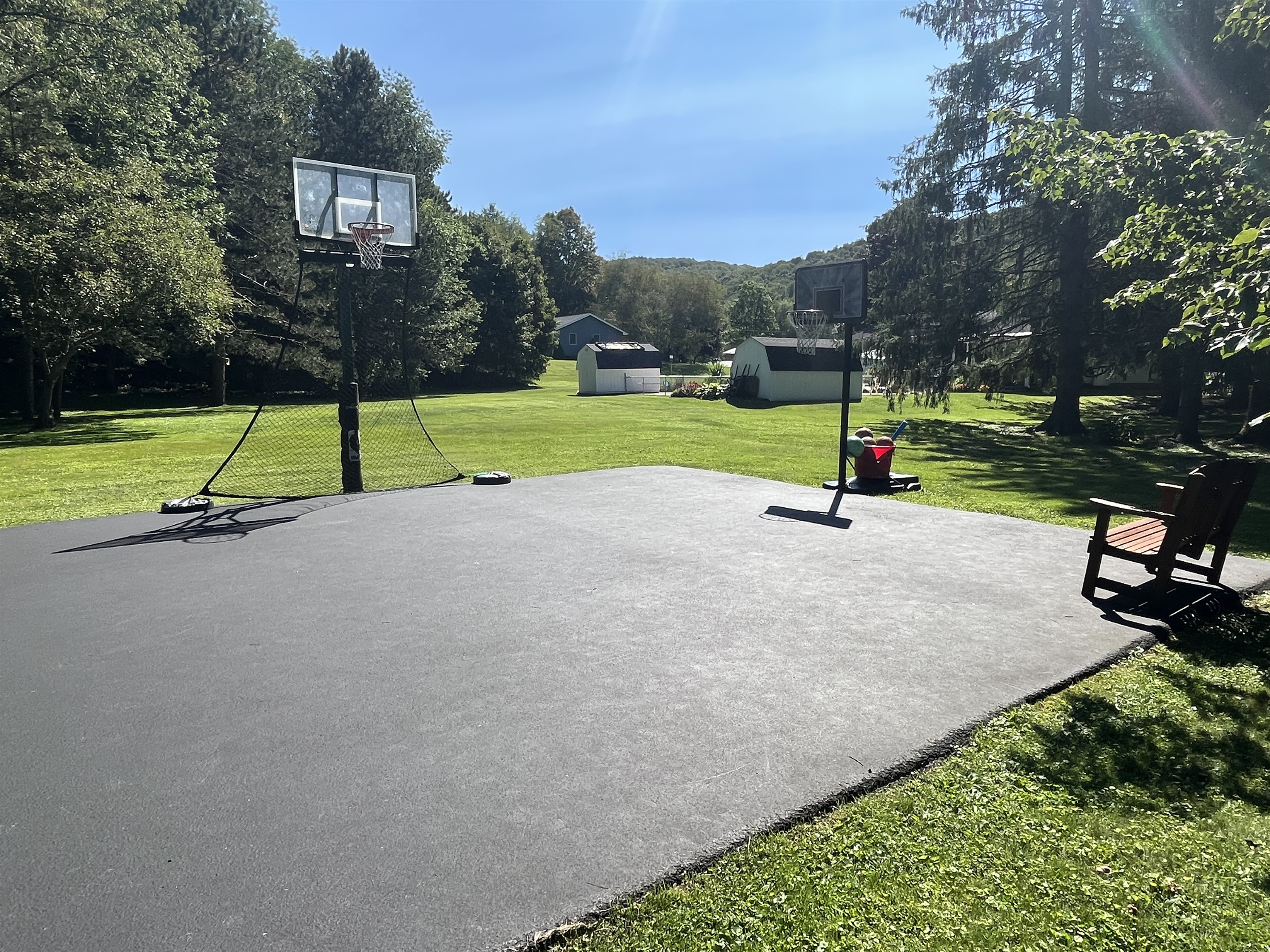Basketball hoop and plenty of yard space