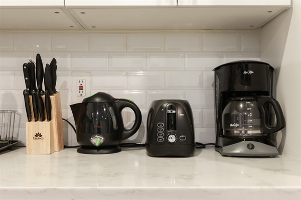 Electric kettle, coffee machine, and toaster oven. 