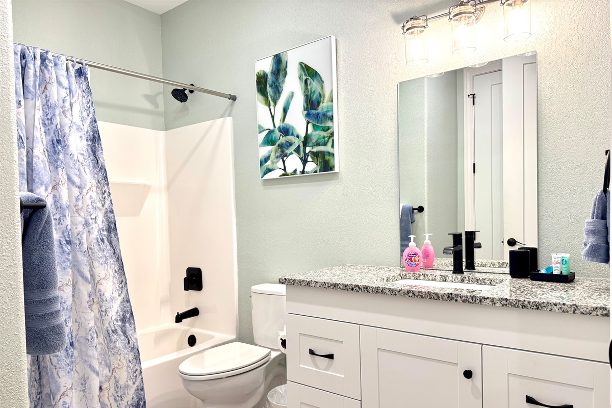 Guest Bathroom 2 with door to hallway and King Bedroom 2