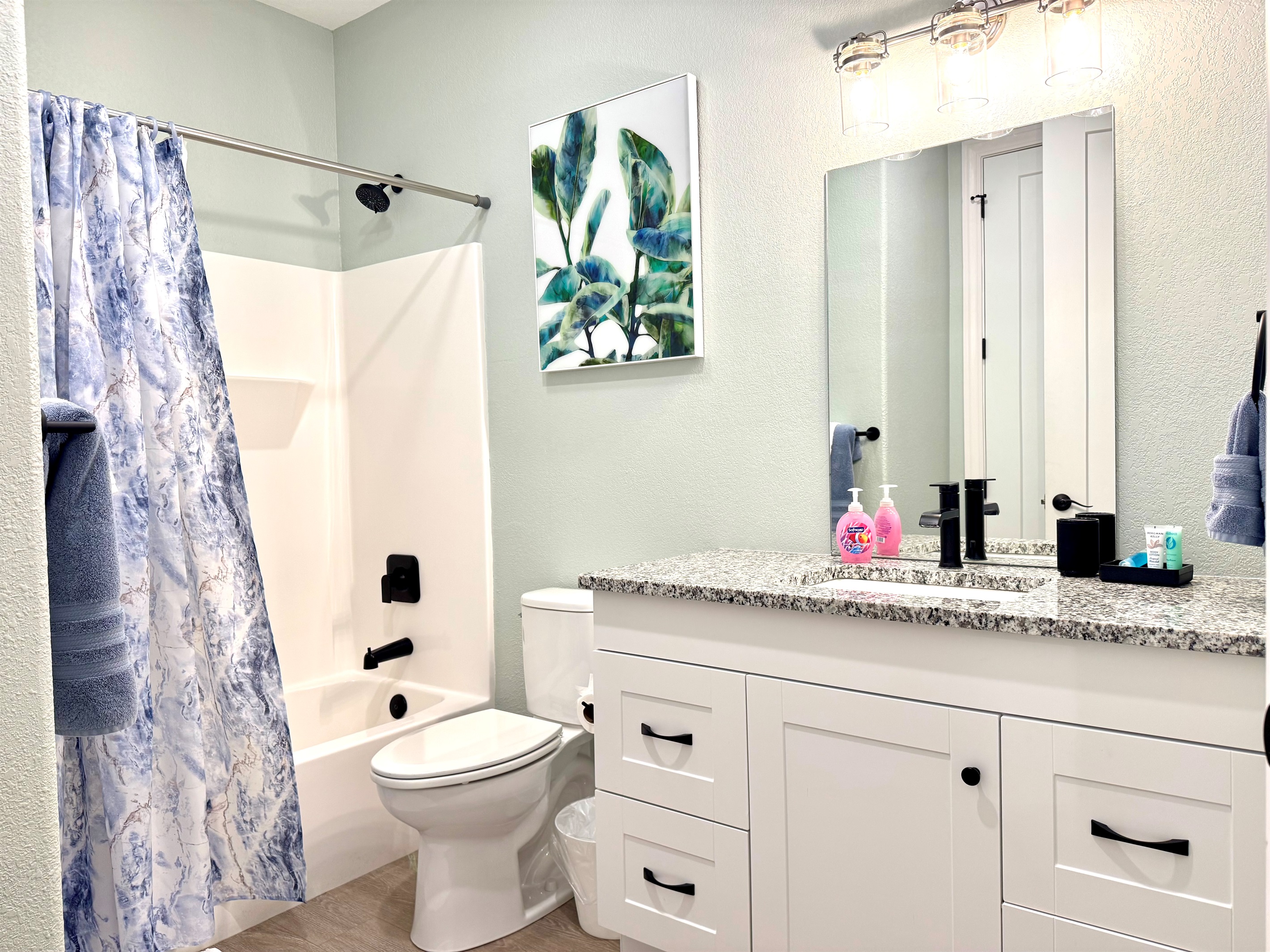 Guest Bathroom 2 with door to hallway and King Bedroom 2