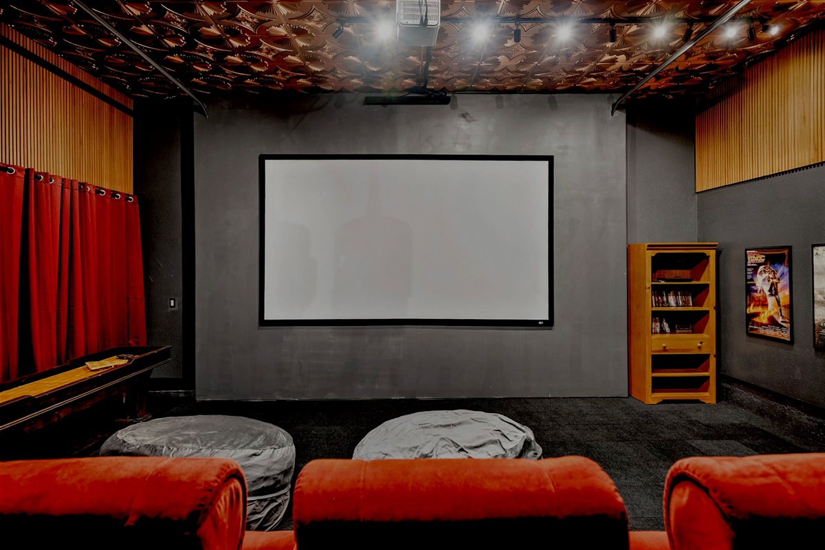 Movie nights come to life on the massive 155” screen powered by a Hisense PX3-Pro 4K Triple Laser Smart Projector, complete with Blu-ray player and movie collection.