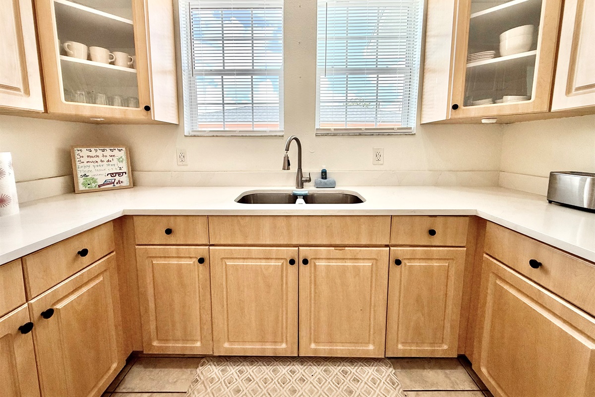 Airy and modern with subtle farmhouse flair—this kitchen’s warm tones and natural light make it a joy to cook in.