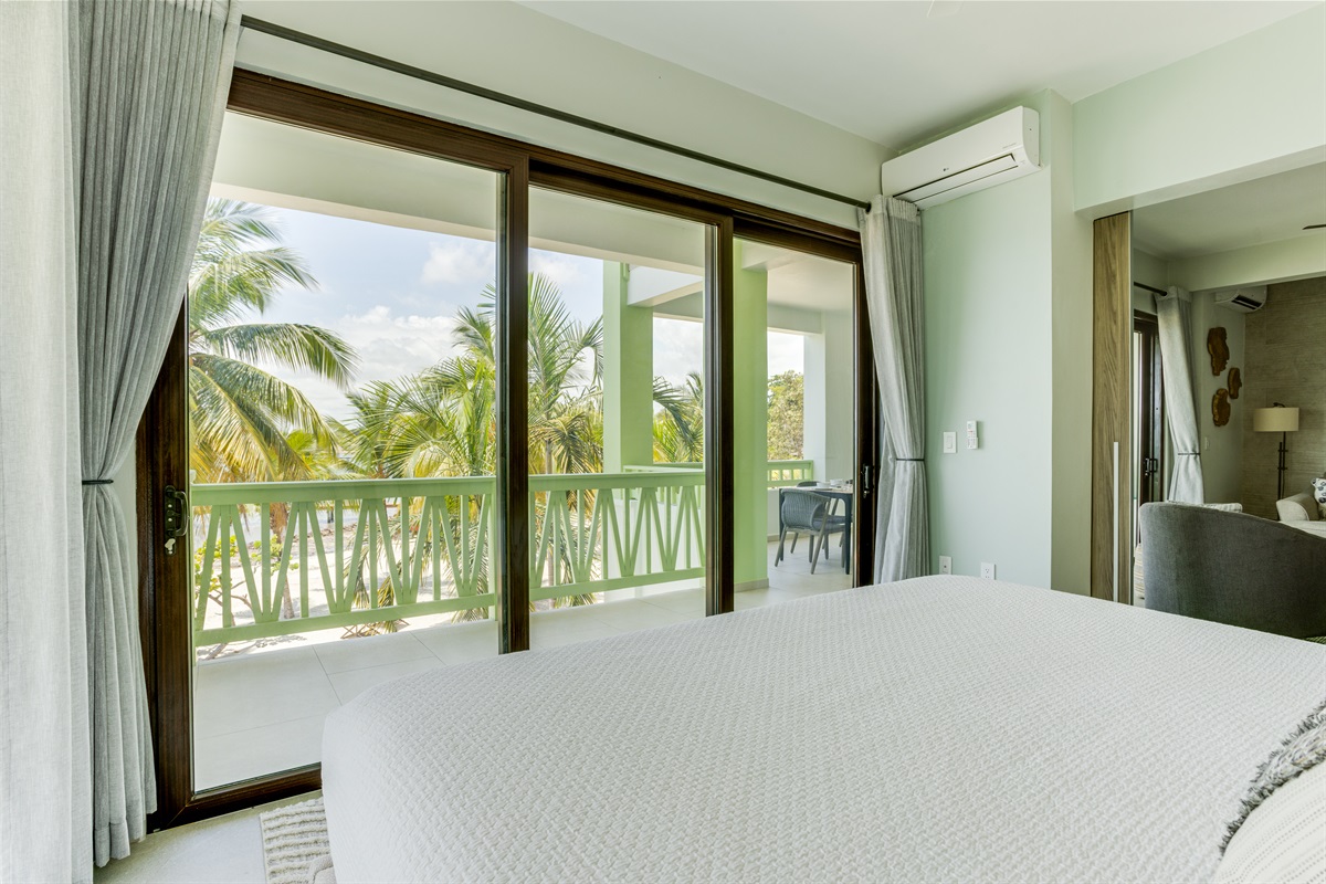 Bedroom 1: King Bed with Patio and Beach View