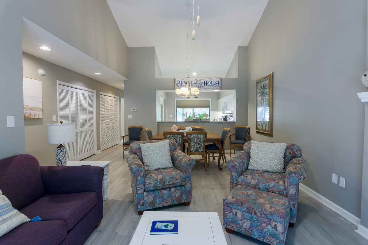 Comfortable living room with large TV and deck access