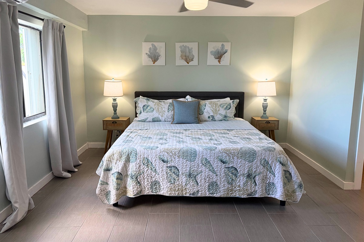 Primary suite has ceiling fan, sitting area, walk-in closet and ensuite bathroom