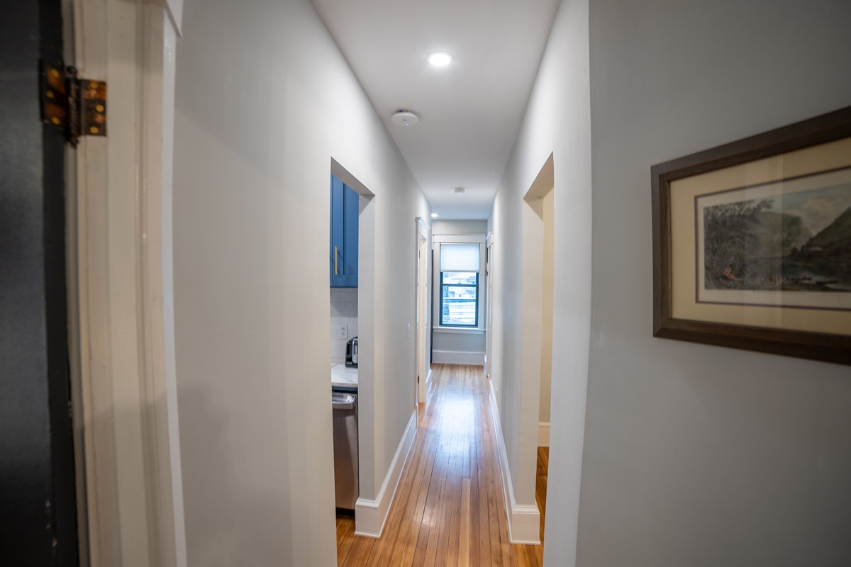 Hallway separates bedrooms for added privacy. 