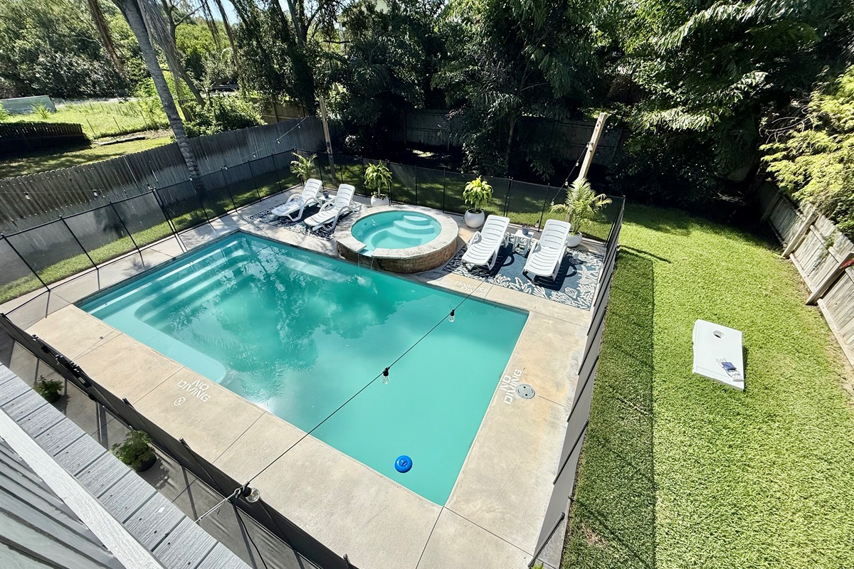 A serene retreat with lush greenery surrounding your private pool.
