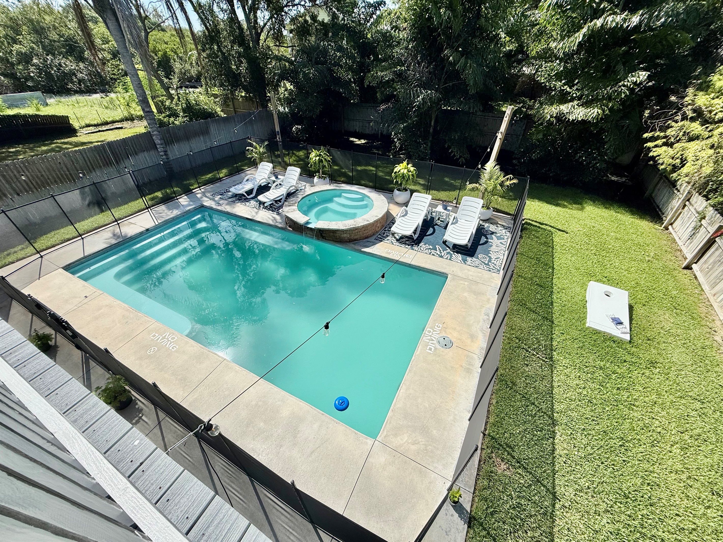 A serene retreat with lush greenery surrounding your private pool.