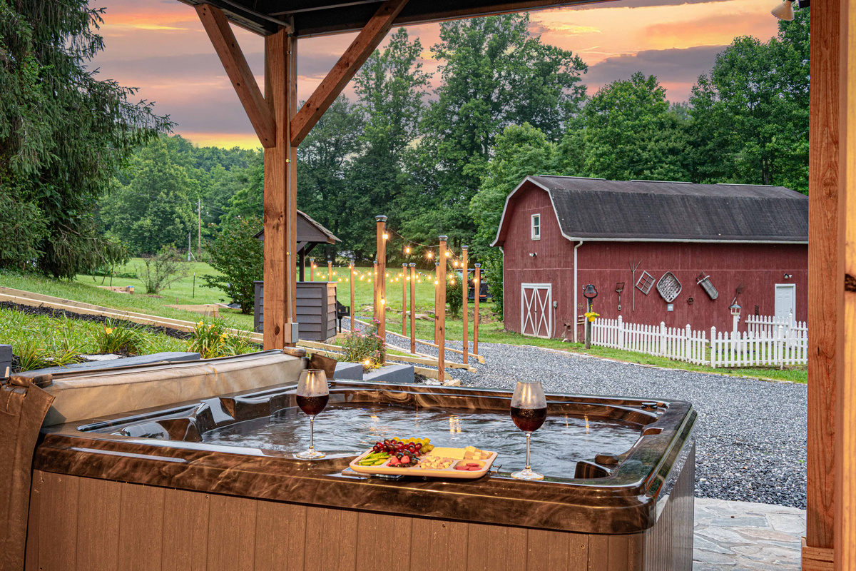 Hot Tub Oasis: Soak in luxury under twinkling lights with stunning countryside views!