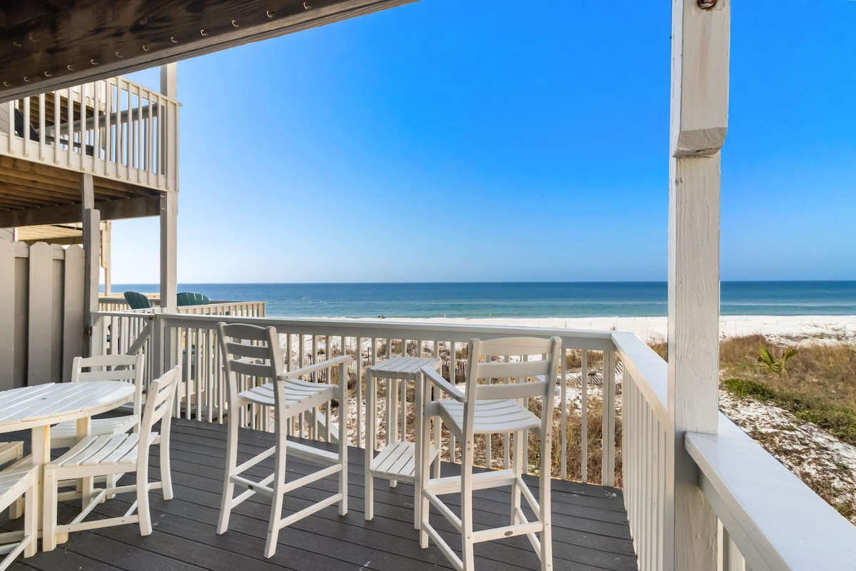 Take in the full panoramic sweep from the main level deck &mdash; gulf views in every direction, chairs already waiting.
