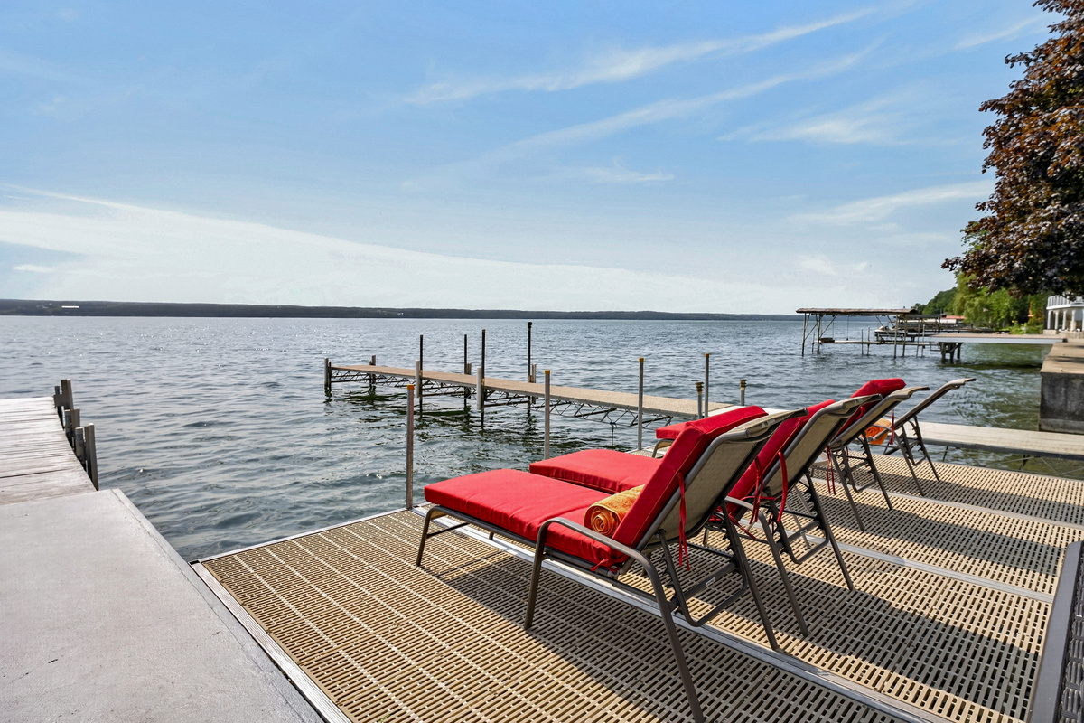 Red loungers overlooking the dock
