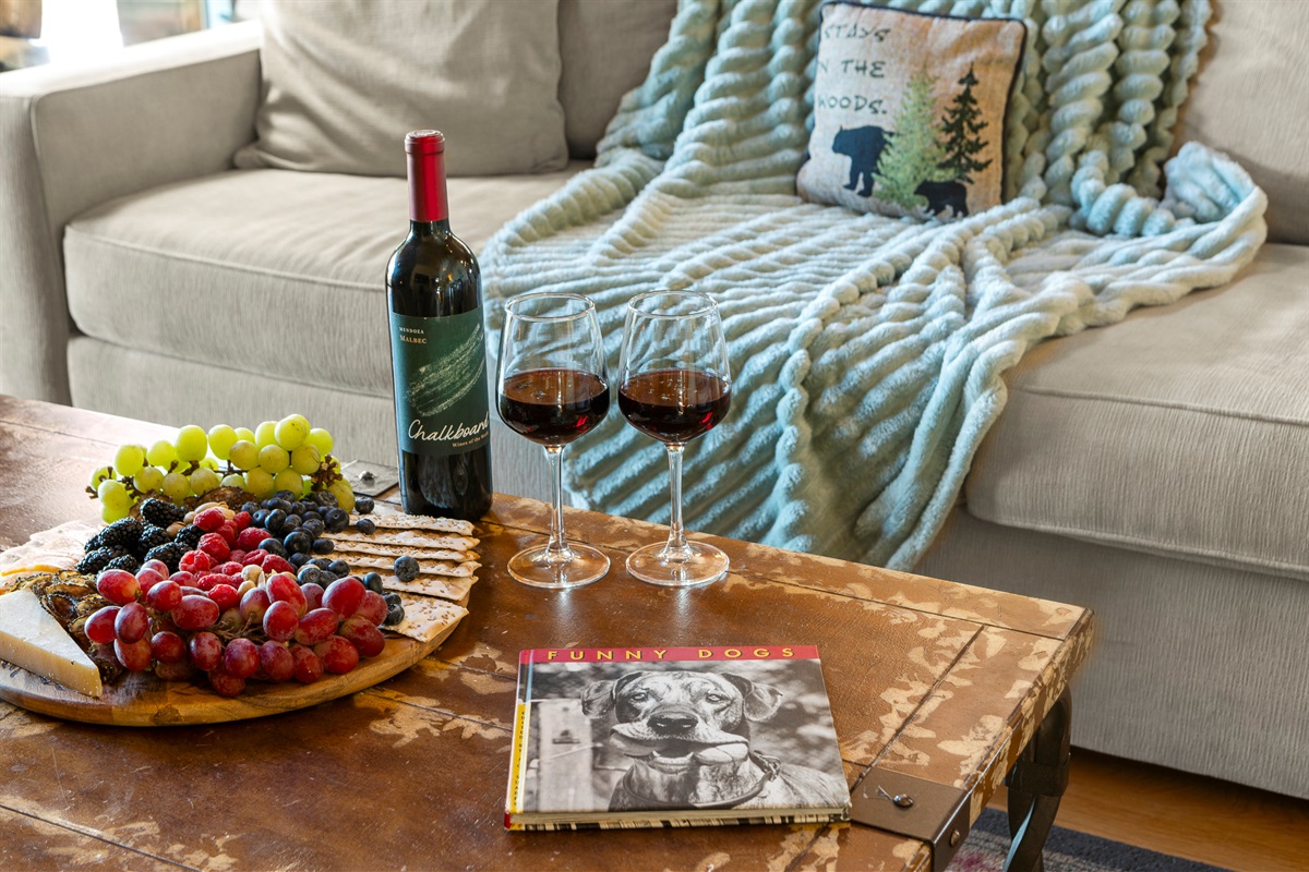 Living Room: Sip wine and unwind with treats, laughter, and charming decor in this inviting space!

