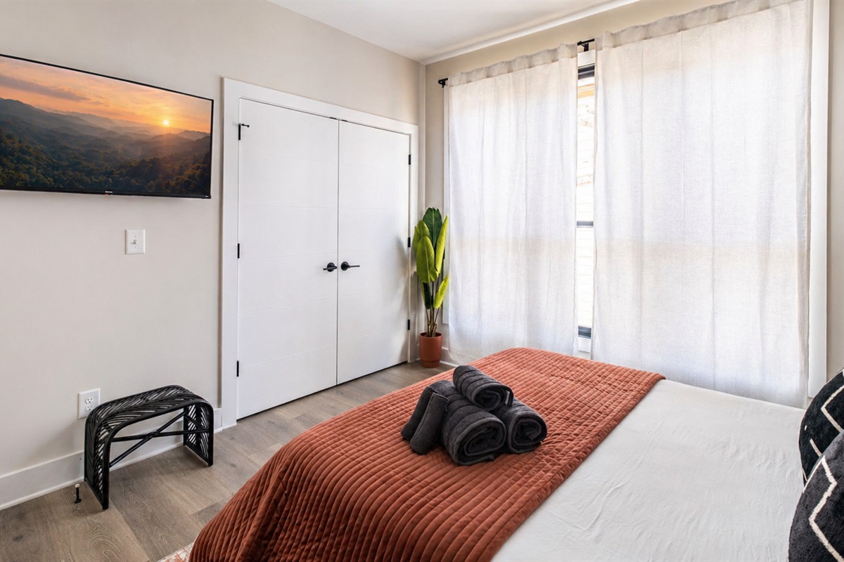 Wake up to soft natural light in this serene third-floor retreat, featuring a queen bed, fresh linens, and a calming, modern design. SmartTV for watching your favorite TV shows in bed. 