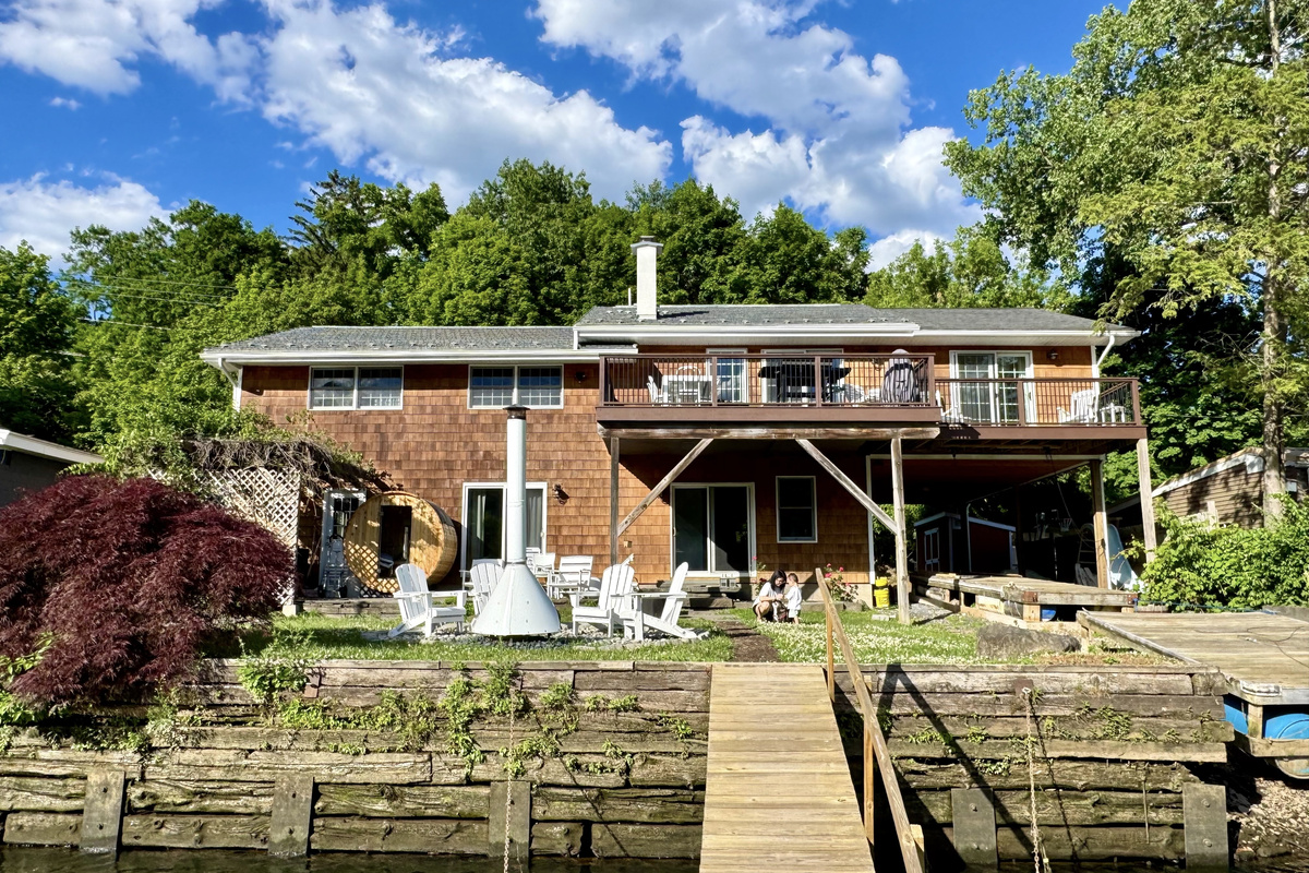 Waterfront retreat with private dock access and panoramic river views