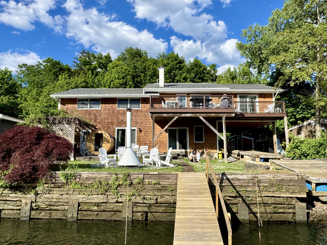 Waterfront retreat with private dock access and panoramic river views
