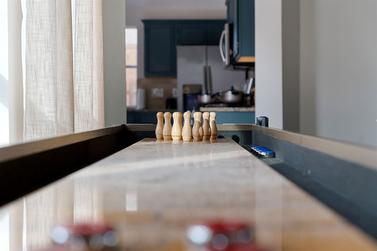 Enjoy our Shuffleboard area where players strategize and slide their pucks, aiming for victory in the smooth glides of shuffleboard bliss.