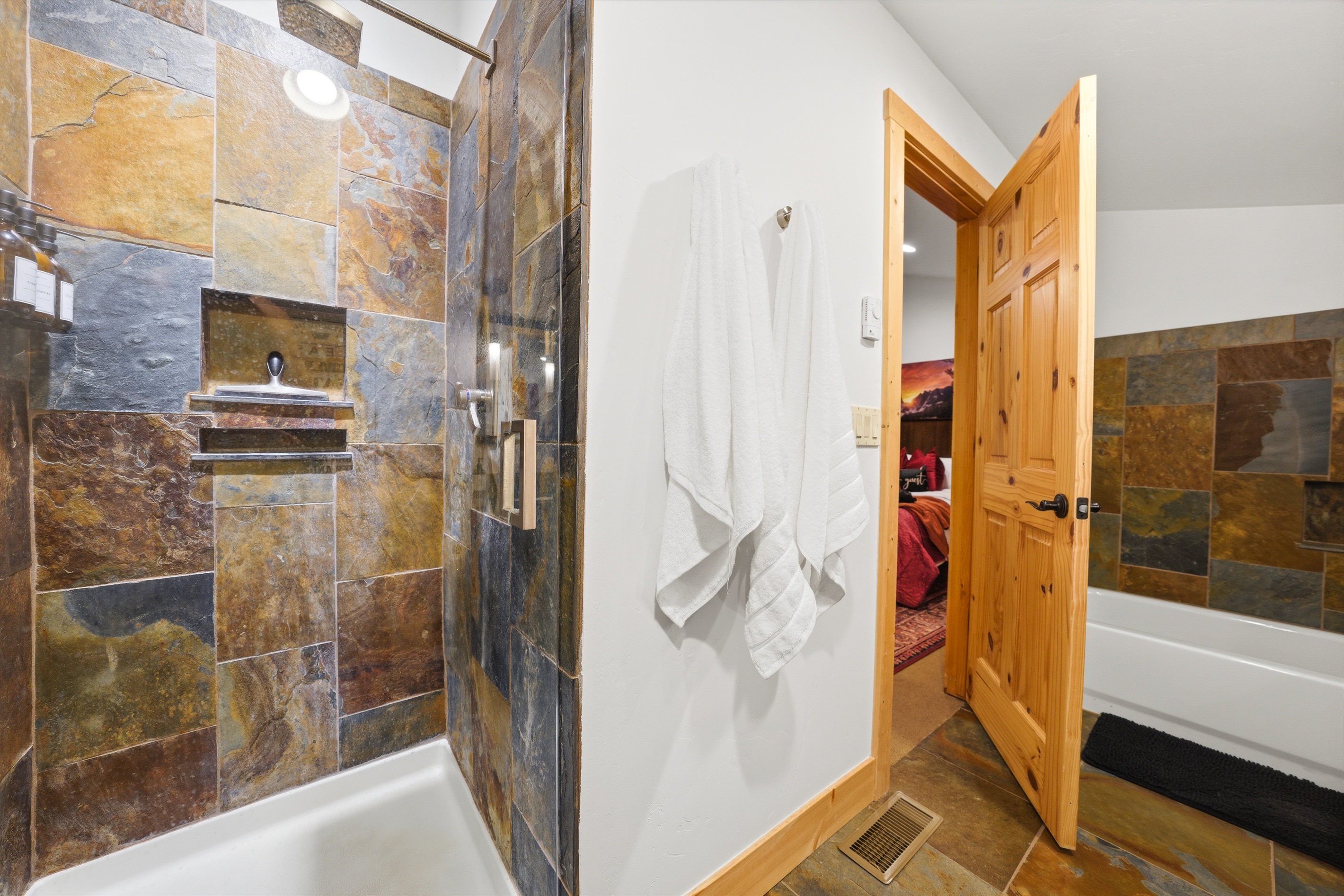 Wash away the day surrounded by warm, natural textures and serene design.