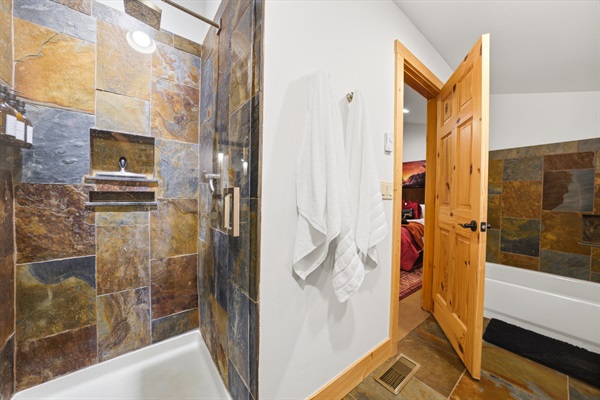 Wash away the day surrounded by warm, natural textures and serene design.