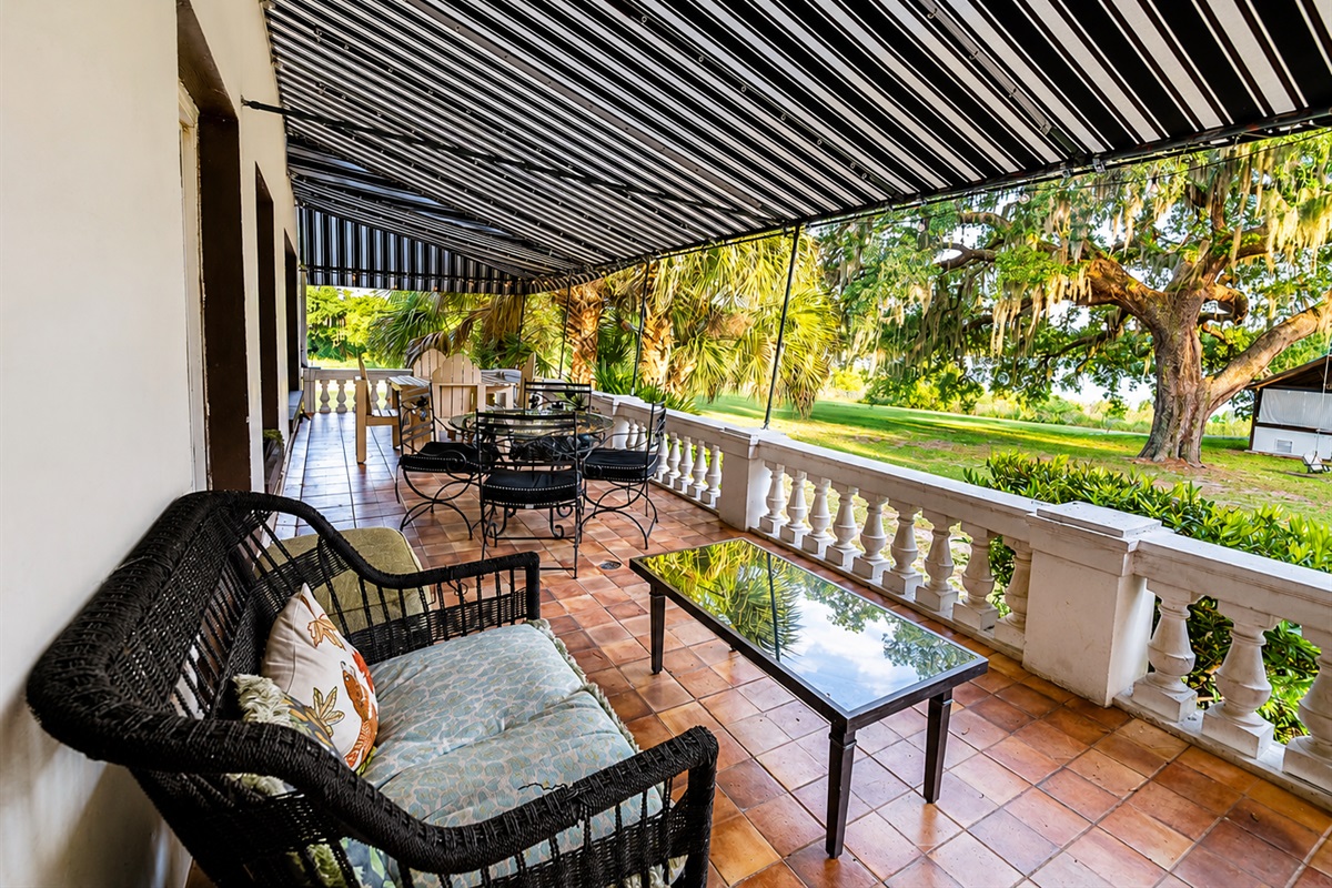 Relax on the covered back patio with lake views, ideal for morning coffee and sunset unwinding.