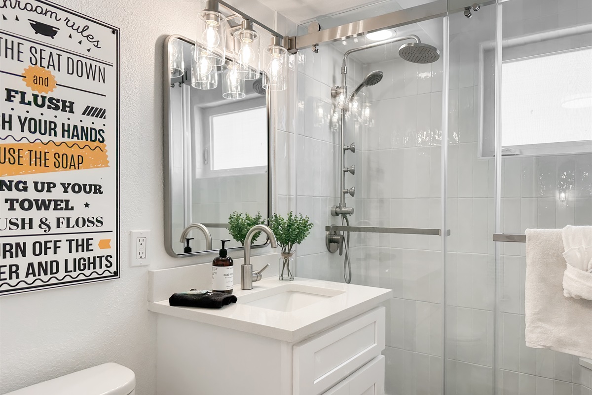 The full bathroom around the corner has a walk-in shower.