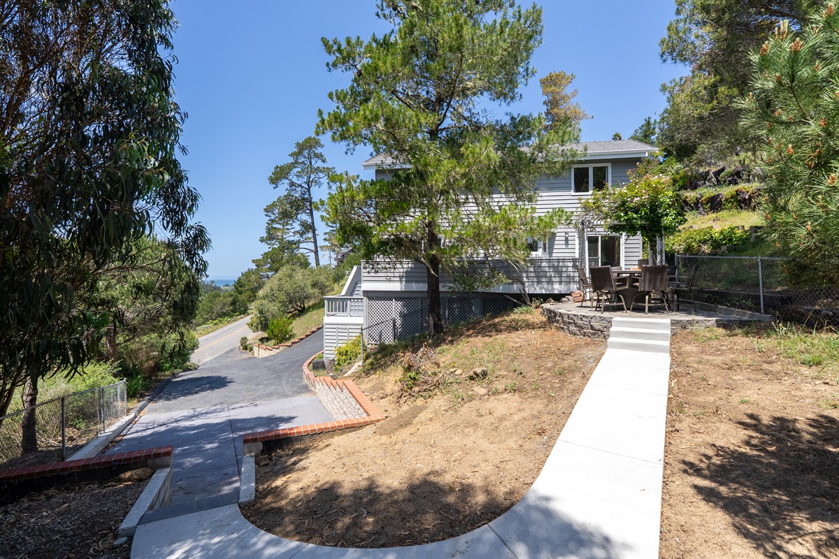 Walk to downtown from this updated home with peak ocean views.