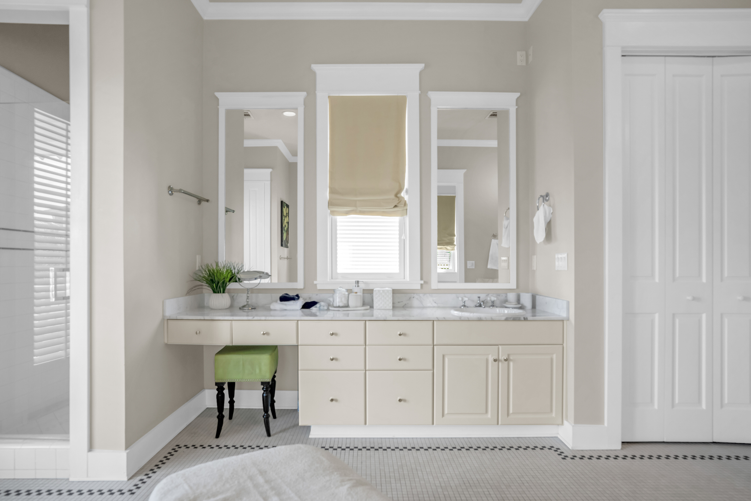 2nd floor king bedroom ensuite bathroom with double vanity, tub and shower.