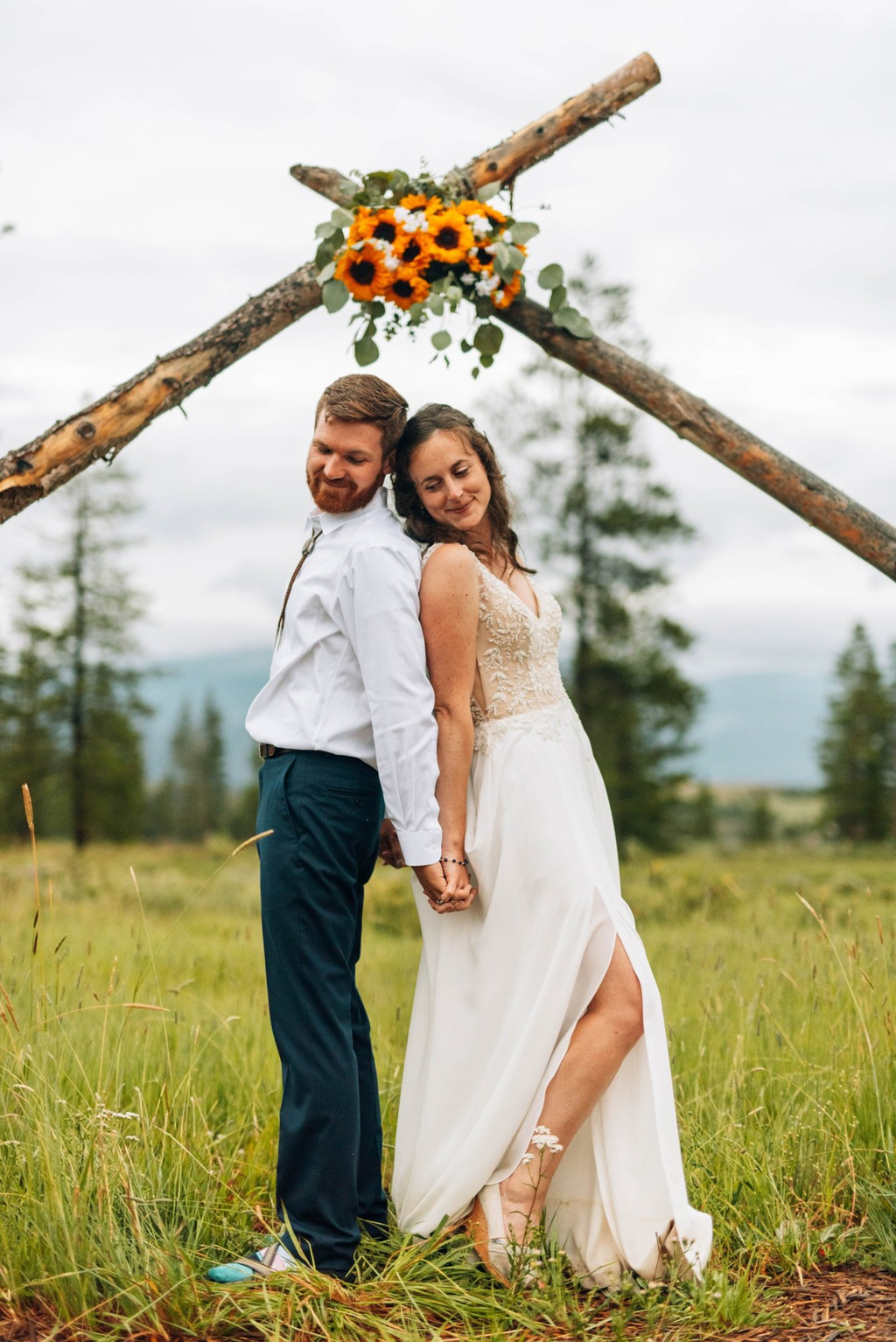Bride and groom at the ceremony arch