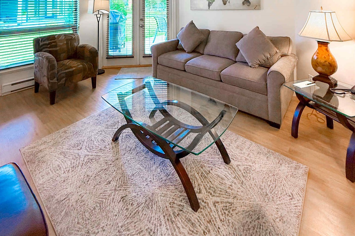 Unit A  - Living room with double glass Patio doors.