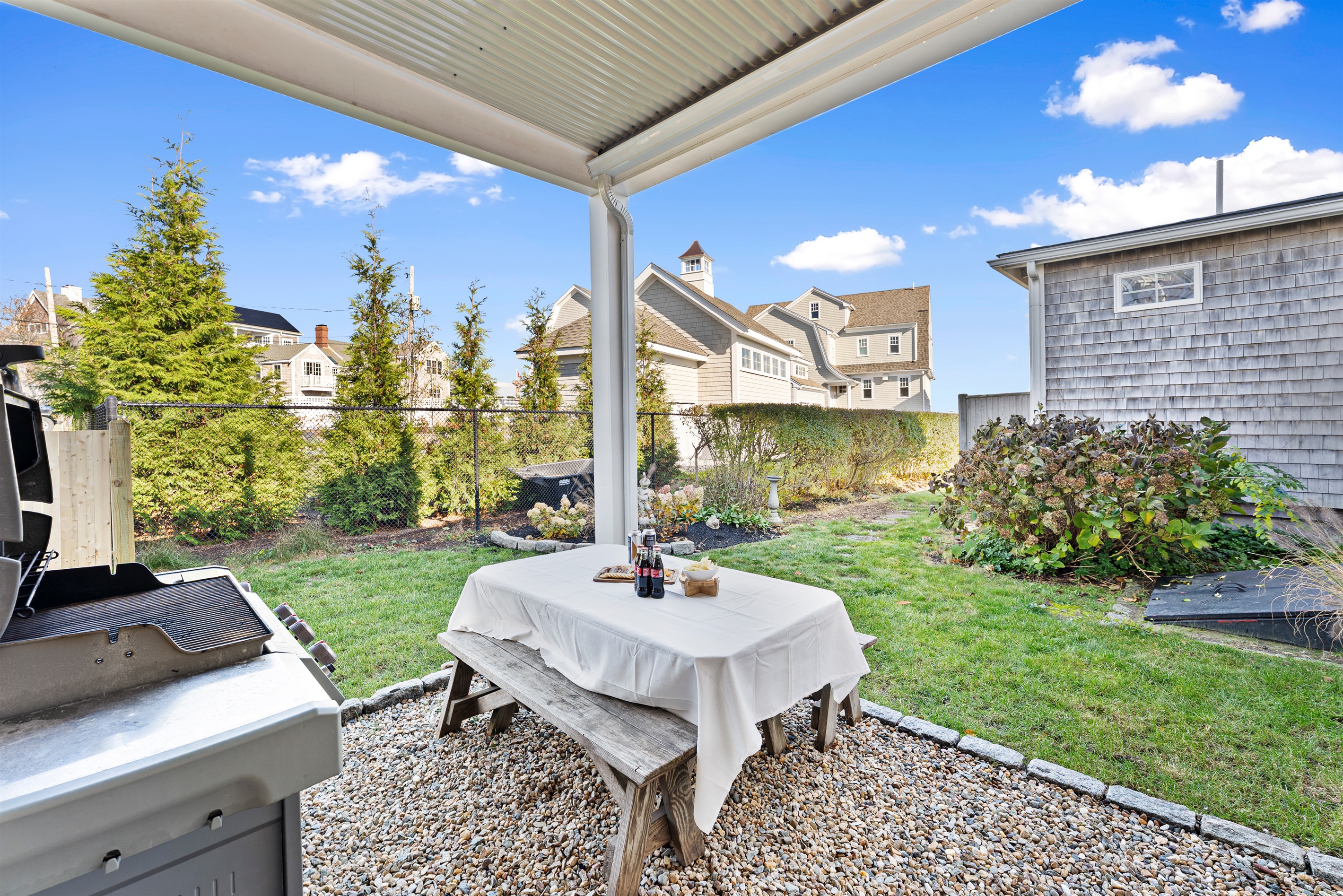 Grill, dine, and relax in this inviting outdoor area.