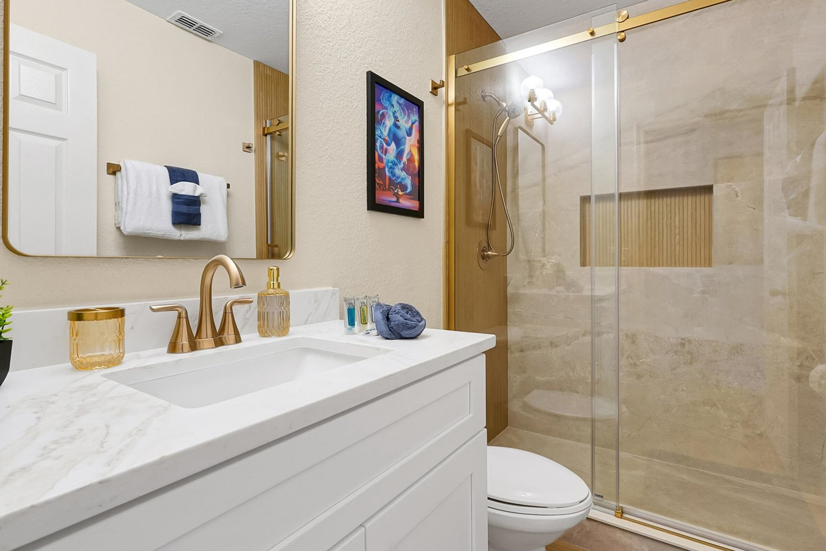 Aladdin King Suite Ensuite: Completely renovated ensuite with a custom-tiled walk-in shower, built-in niche and champagne-bronze finishes.