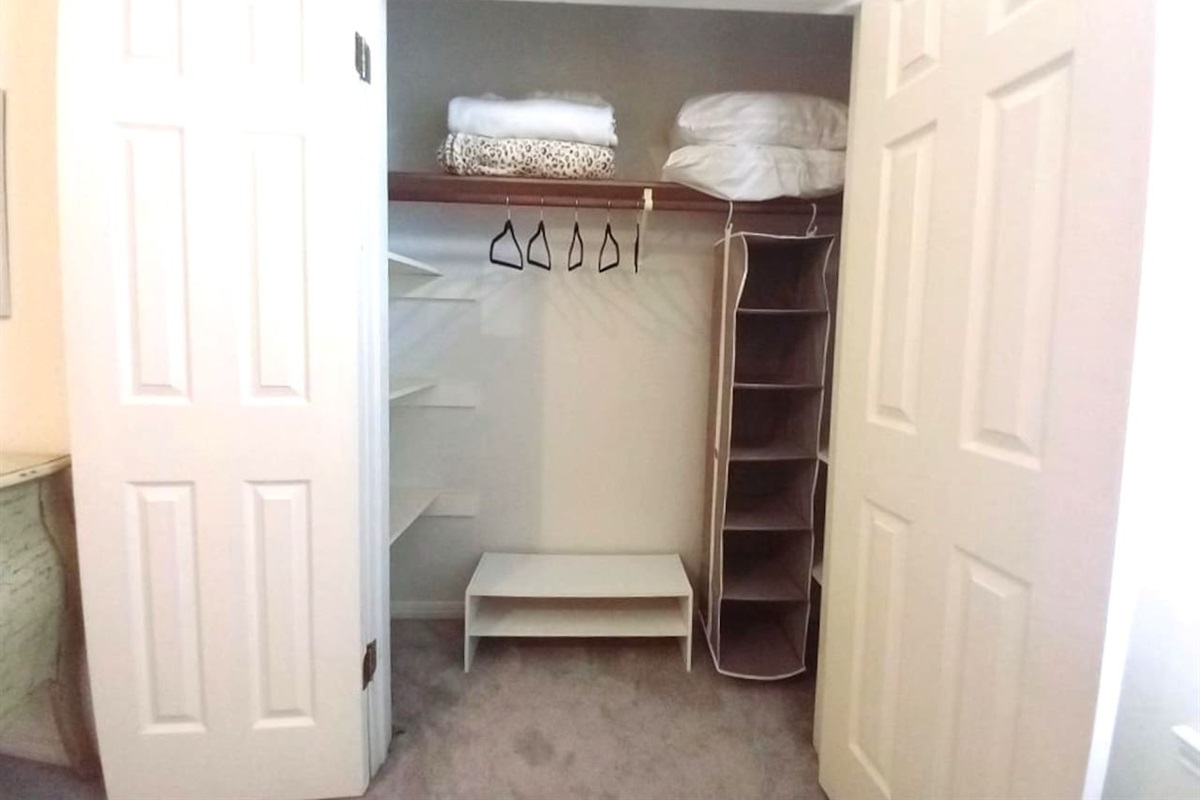 Generous closet space throughout the house.  This closet in Angel's Keep features hanging space, shoe rack and shelving on both sides of the closet.   Great whether staying for a weekend or a month or more.