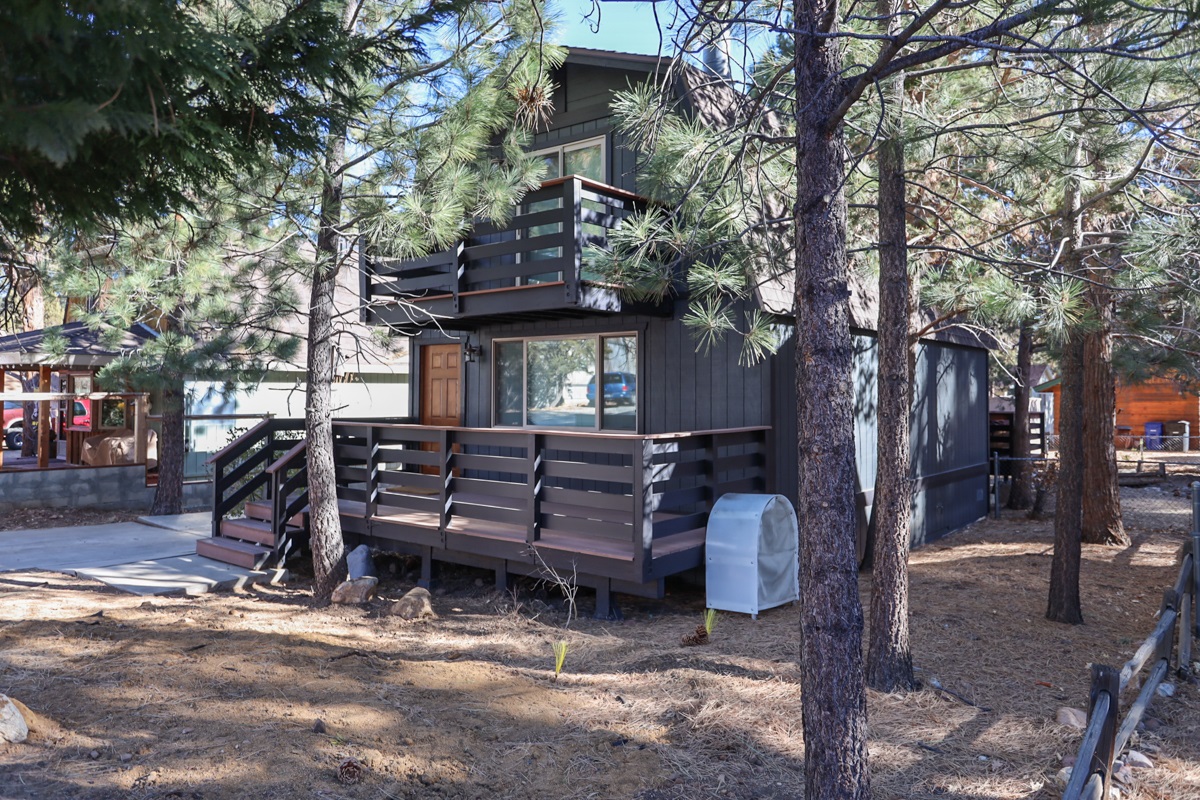There is a deck in front and back, and a balcony off the master bedroom upstairs.