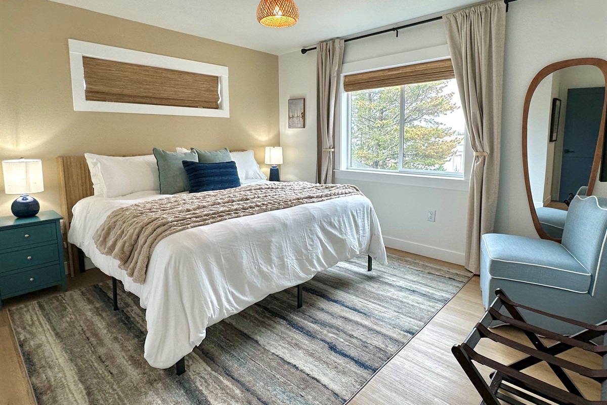 21 Villa A king bedroom — the second upstairs room, dressed for a perfect night's sleep.