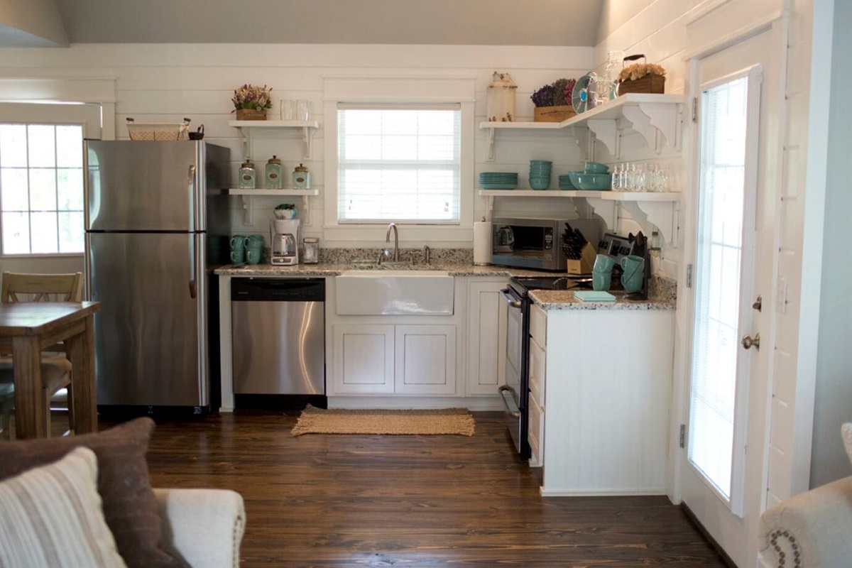 Open shelving in farmhouse style country kitchen in vacation rental