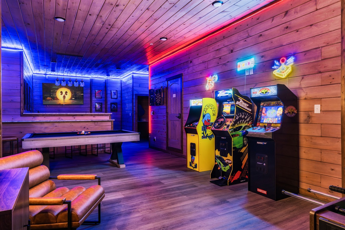 Game room with pool table, foosball table, arcades, board games, theater and half bath