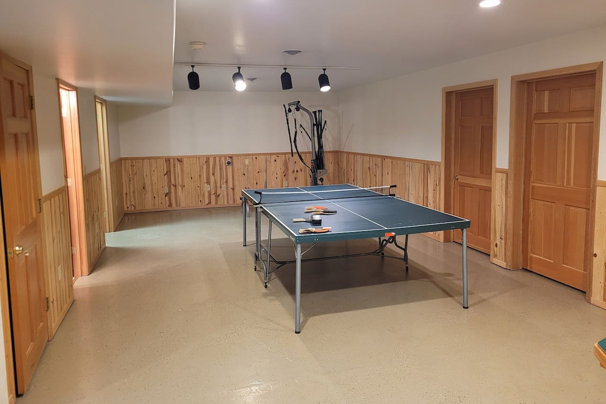 Ping pong table and BowFlex machine. The two fold out cots can be set up in here as well. 